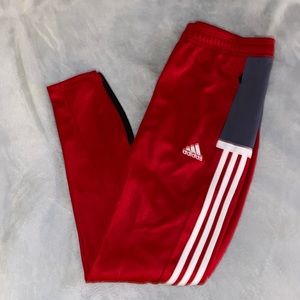 Red adidas track pants